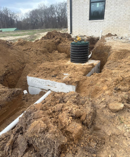 A pile of dirt next to a building